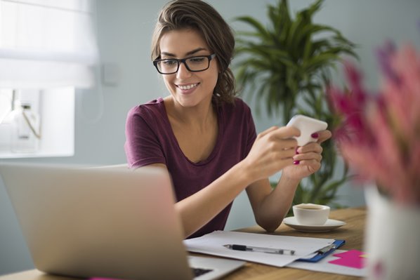 Small business owner looking at laptop