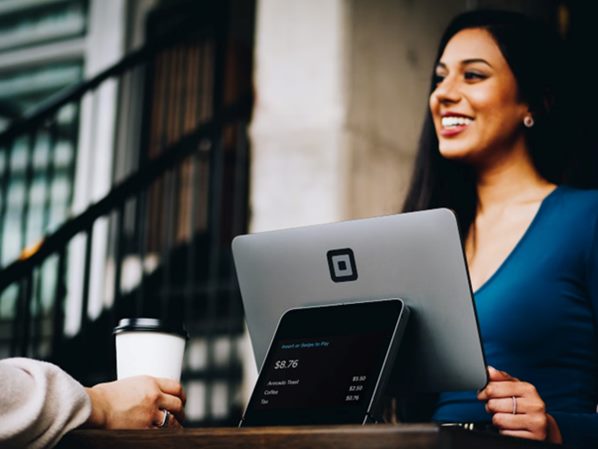 Retail assistant serving a customer